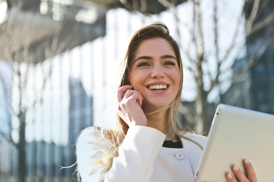 girl smiling with phone to ear
