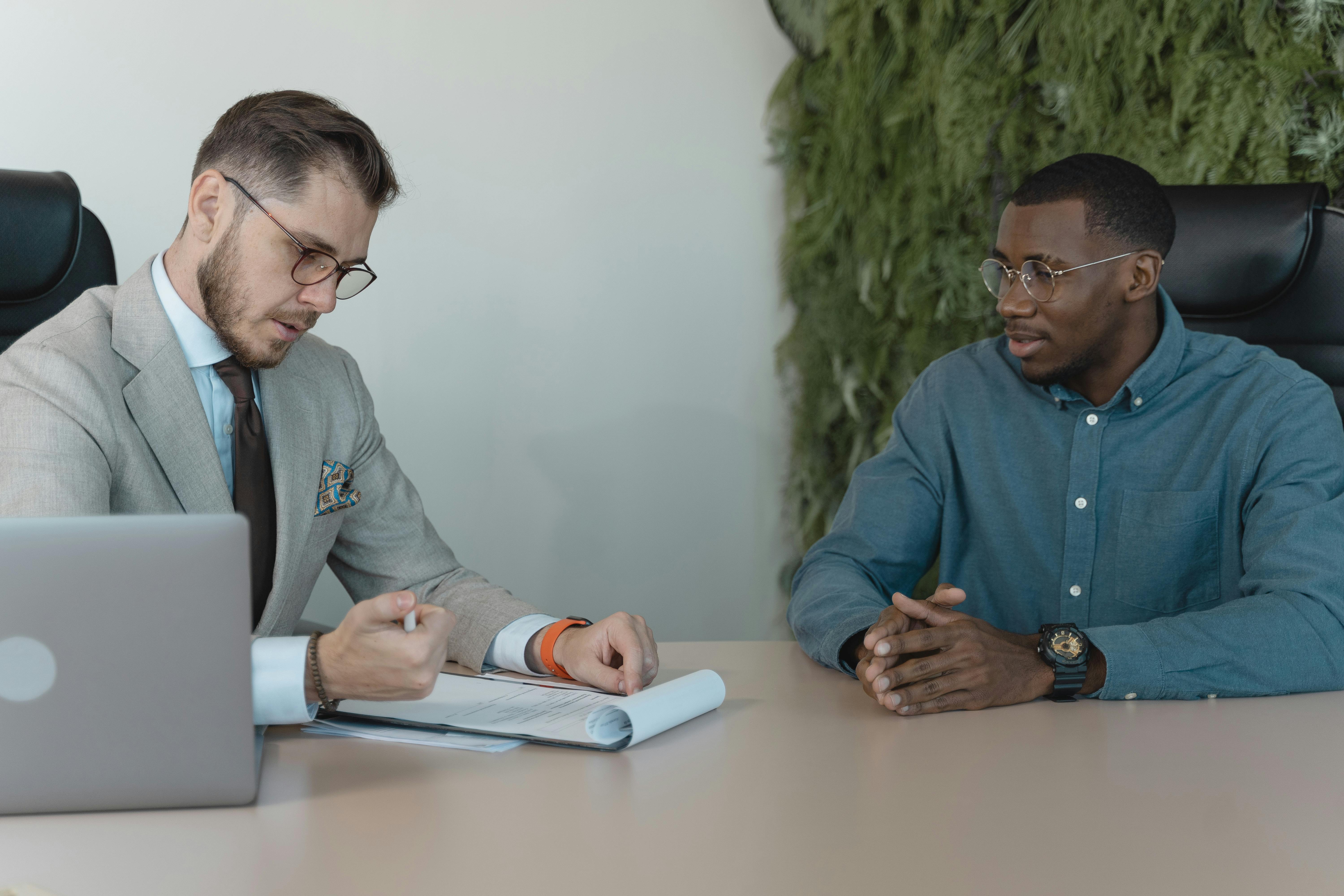 man-in-professional-clothing-reading-a-resume