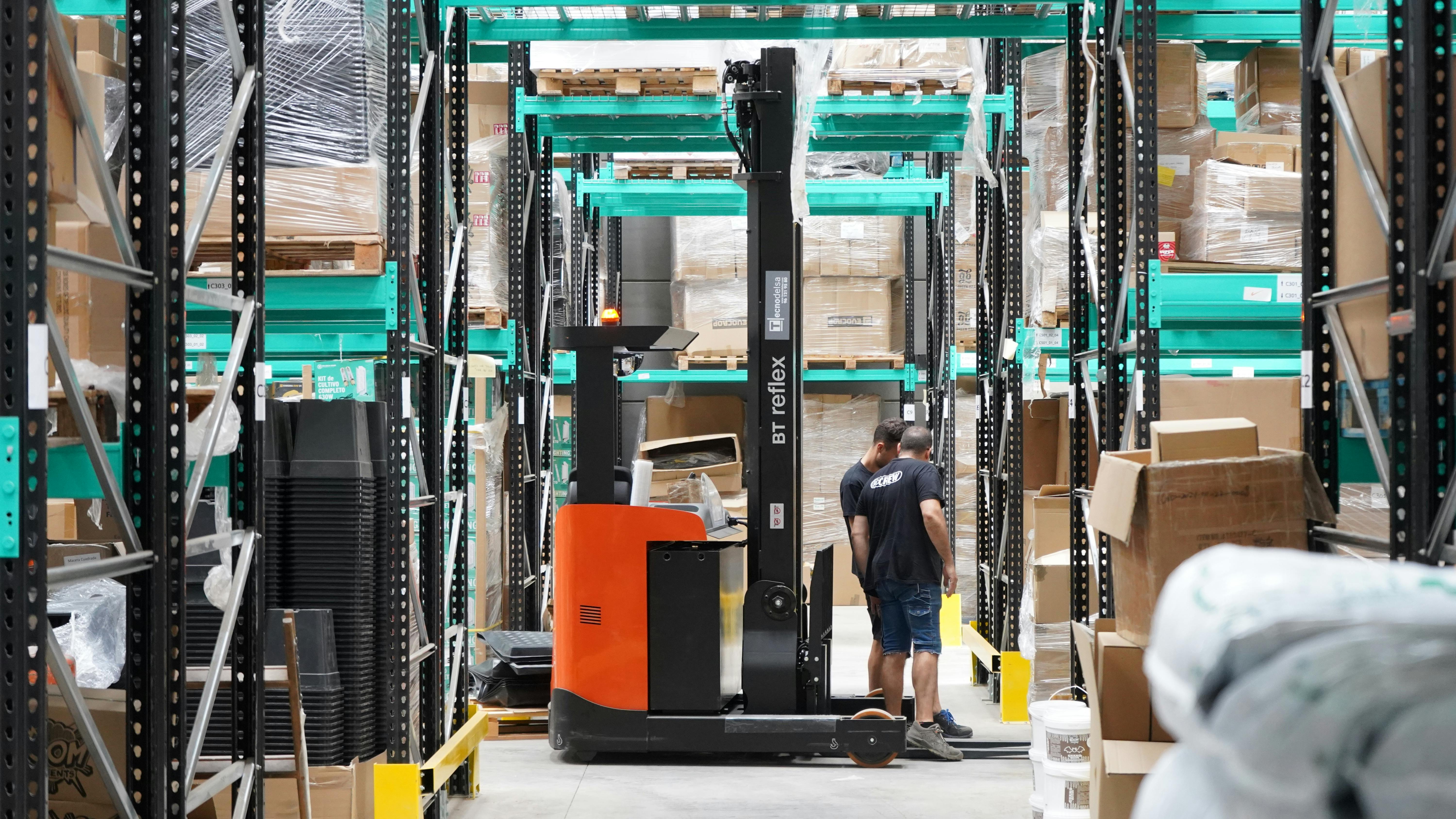 modern-warehouse-operations-with-employees-and-forklift