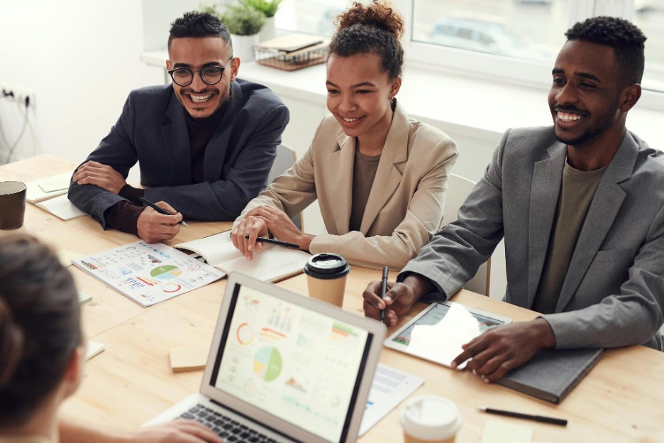 people smiling at desk