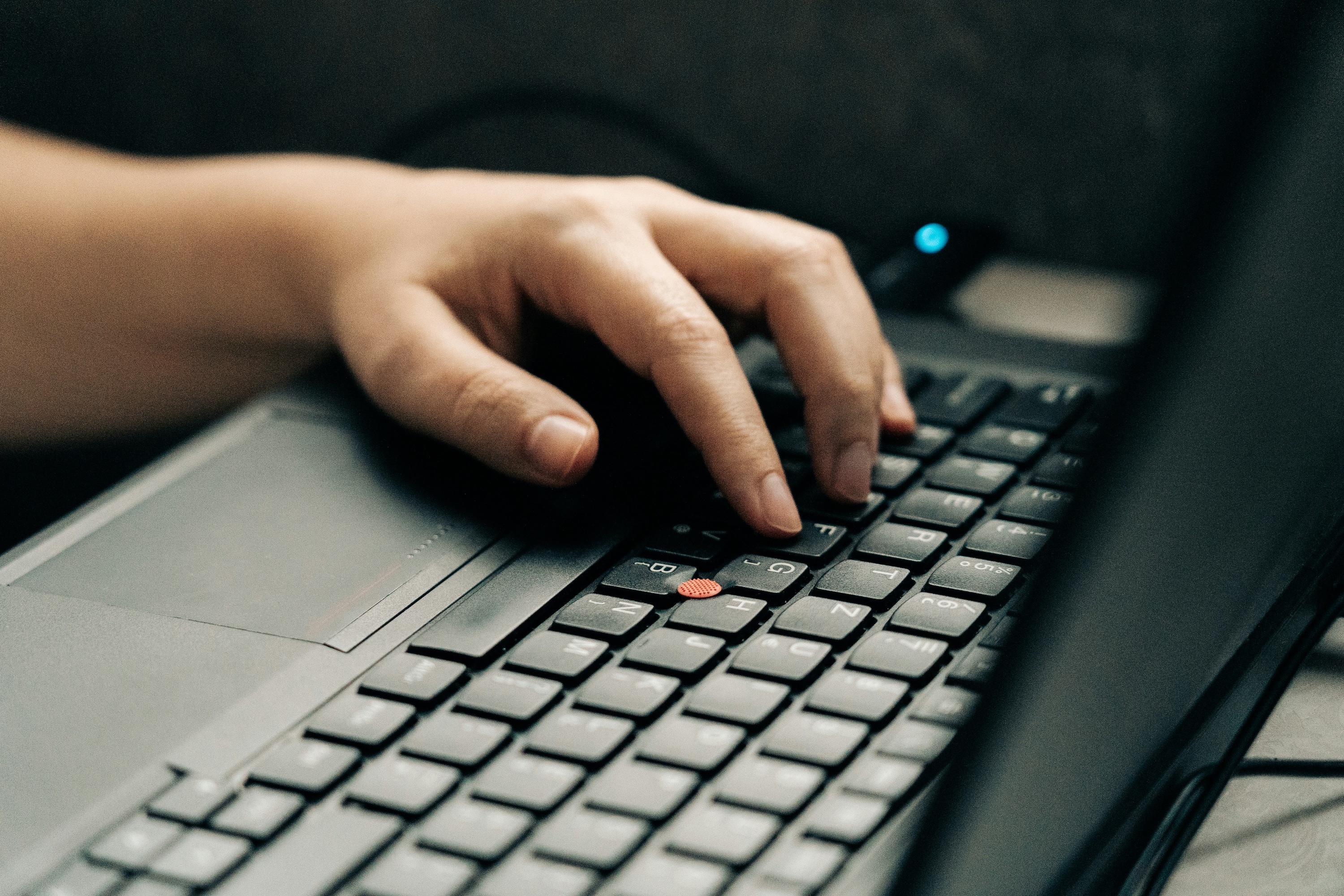 person-using-black-and-gray-laptop-computer