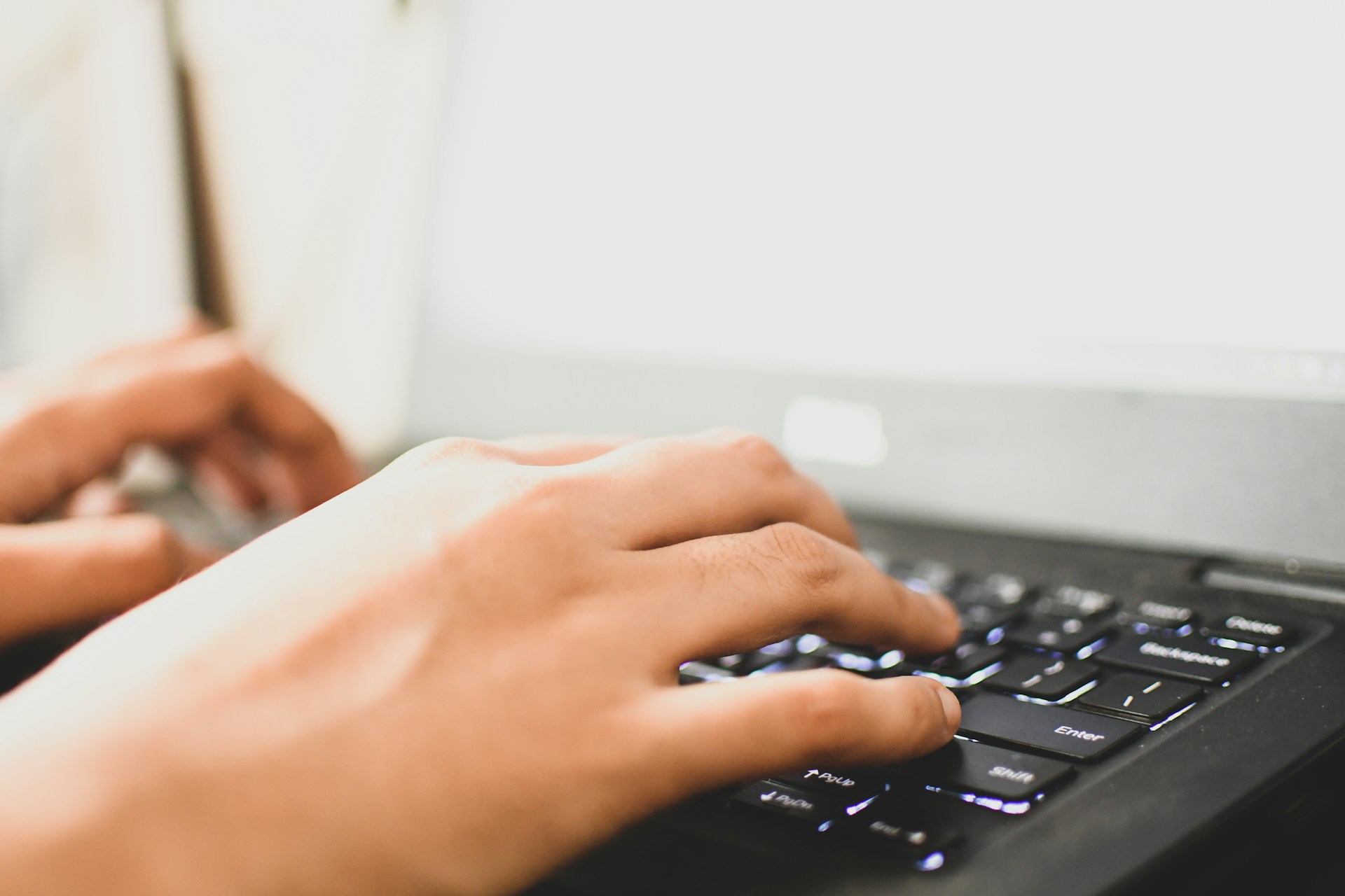person-using-black-computer-keyboard