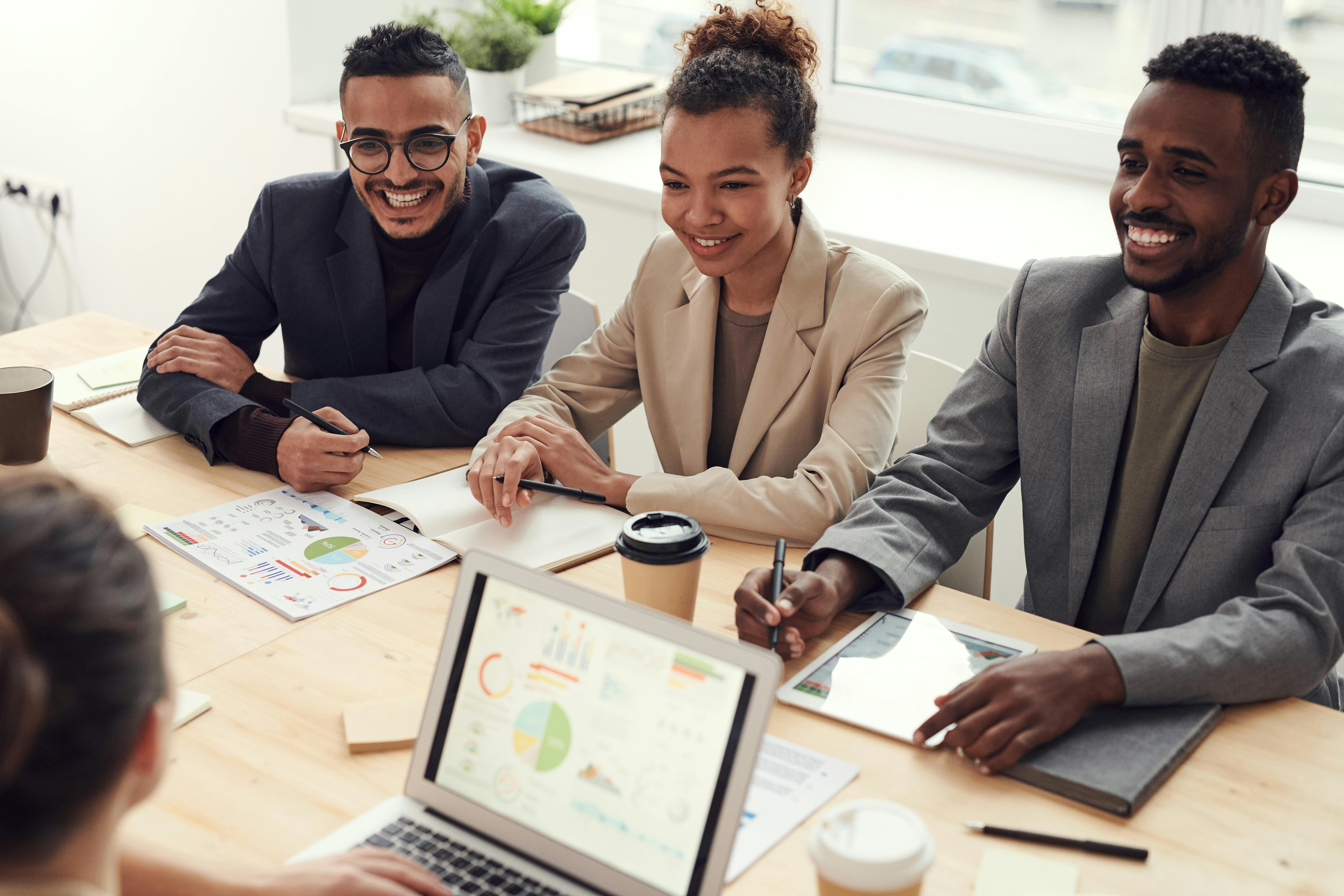 https://www.pexels.com/photo/photo-of-three-people-smiling-while-having-a-meeting-3184338/