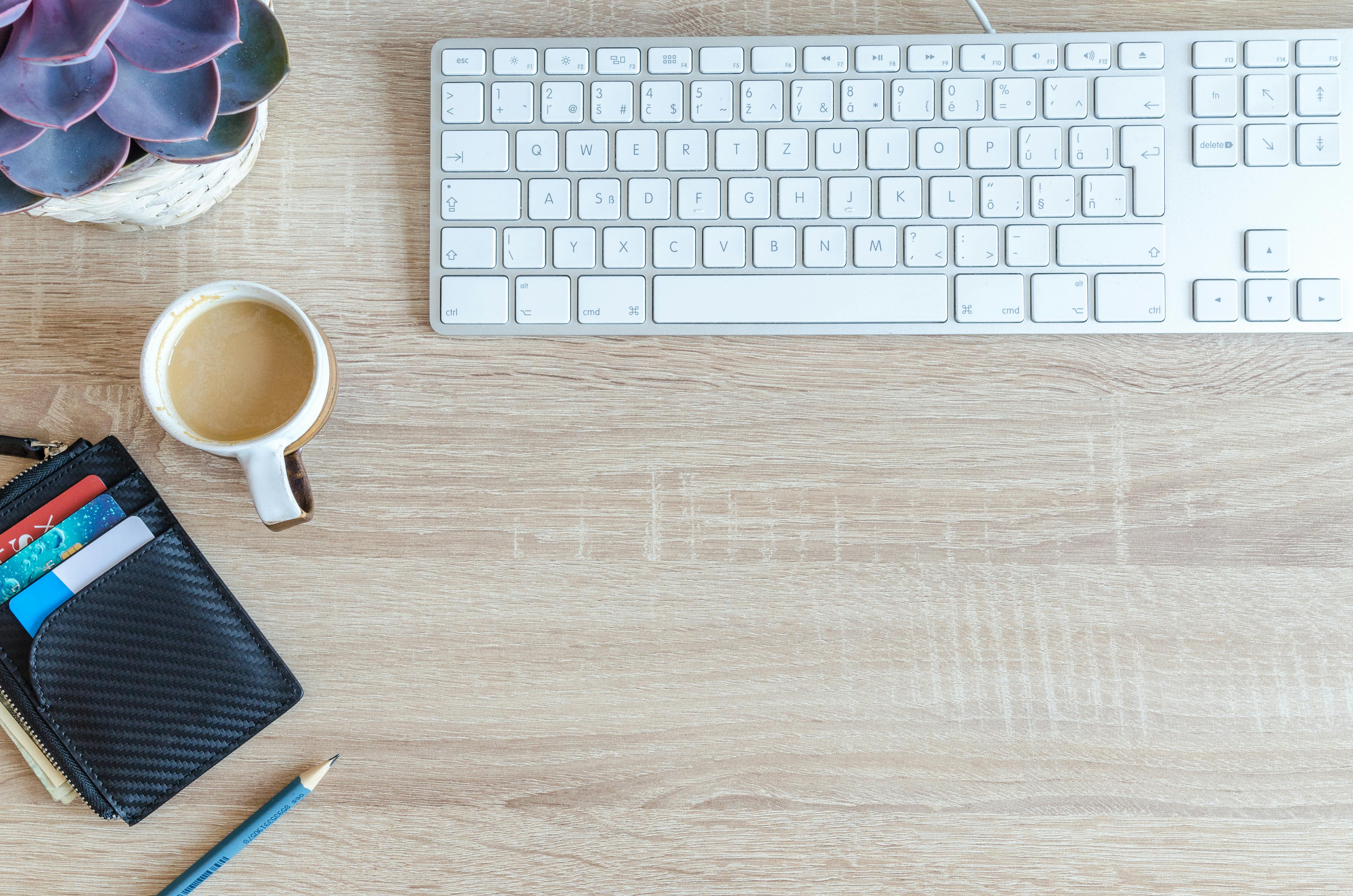 https://www.pexels.com/photo/white-apple-keyboard-near-white-cup-917463/