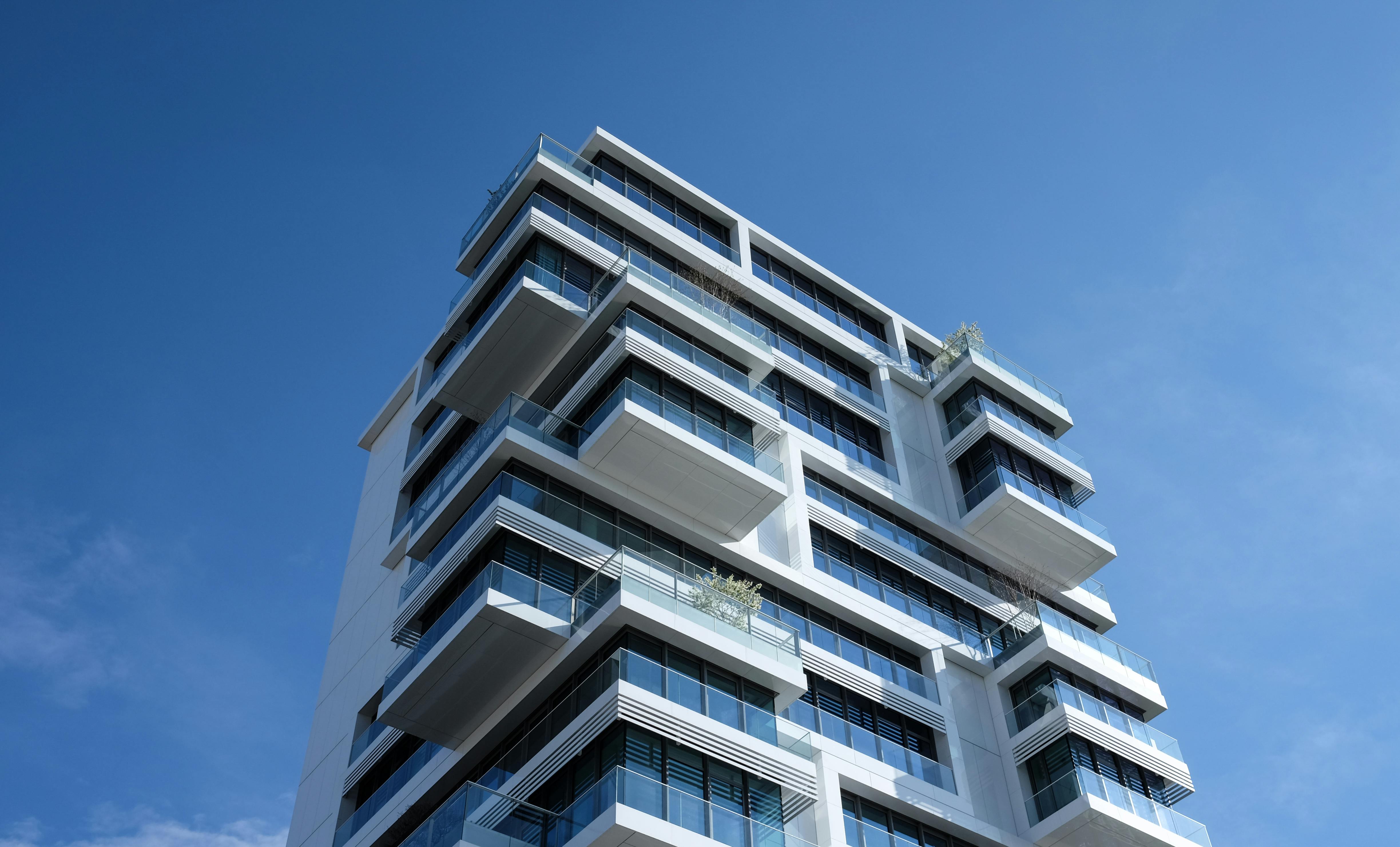https://www.pexels.com/photo/white-concrete-building-under-sunny-blue-sky-87223/