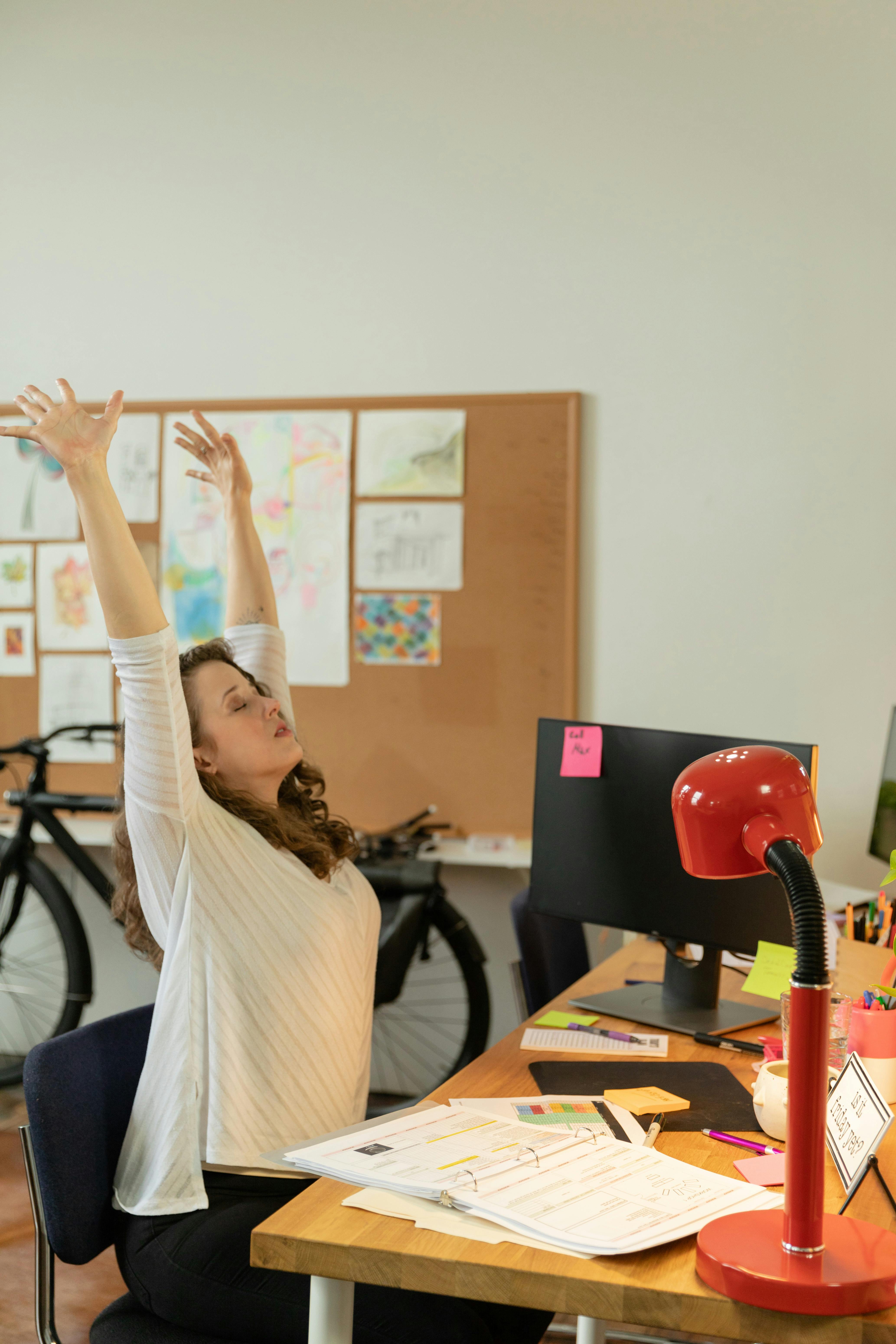 woman-stretching-her-body-while-sitting