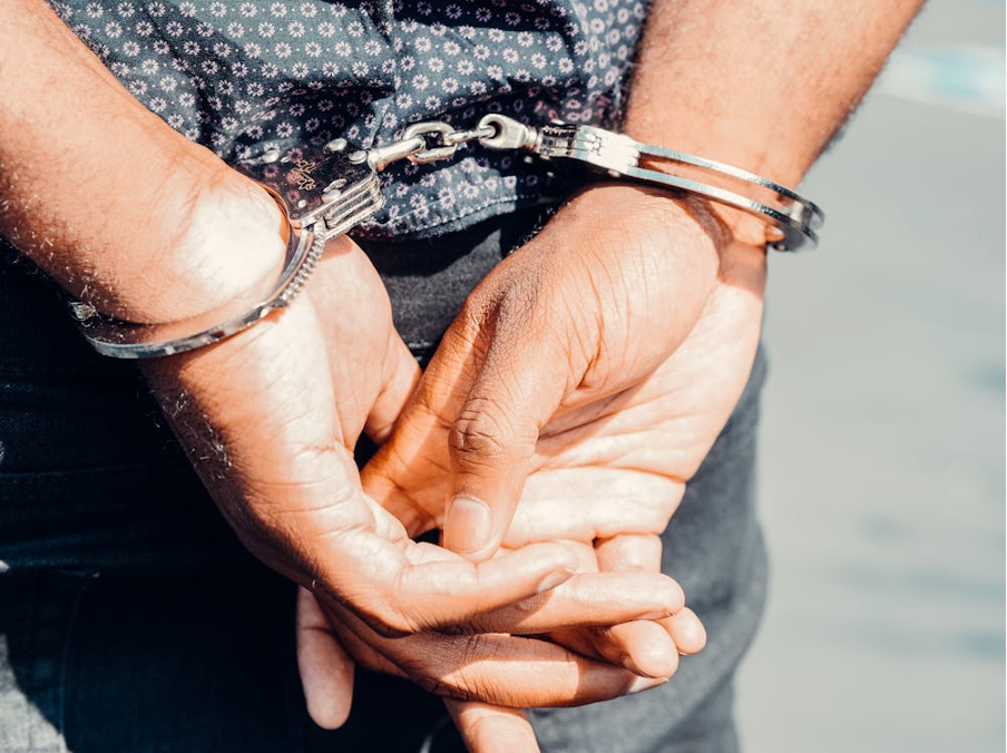 close-up-photography-of-person-in-handcuffs