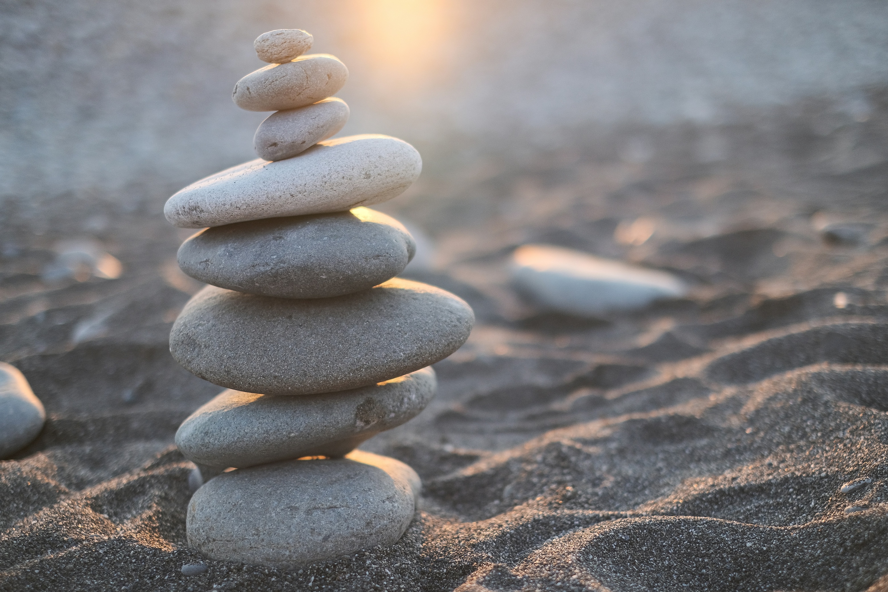 woman-using-tablet-computer stack of stones
