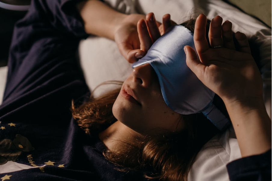 woman-in-bed-wearing-sleeping-mask