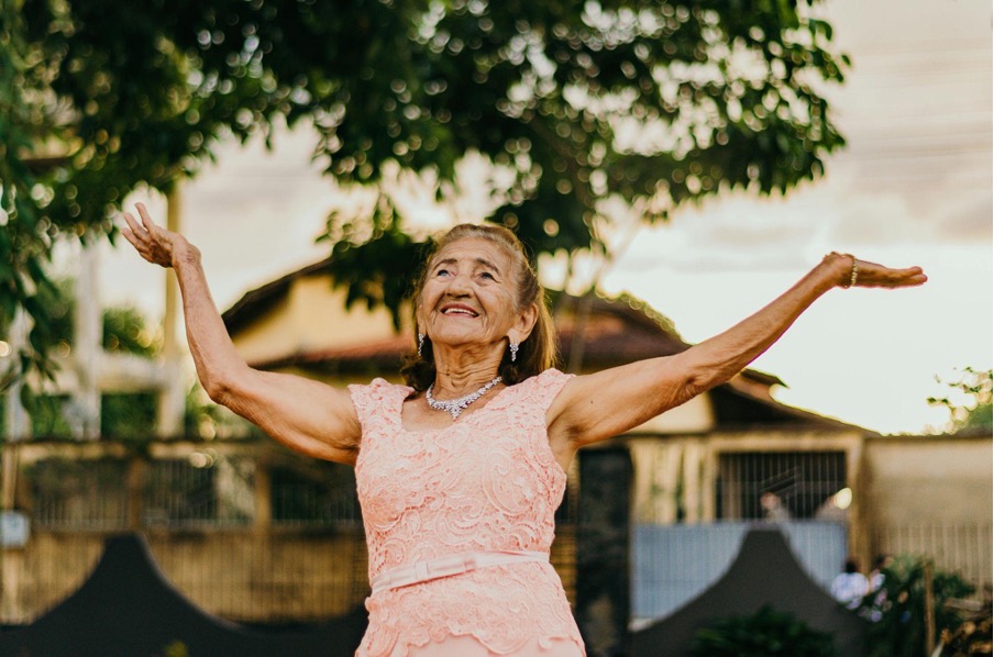 woman raising both her hands