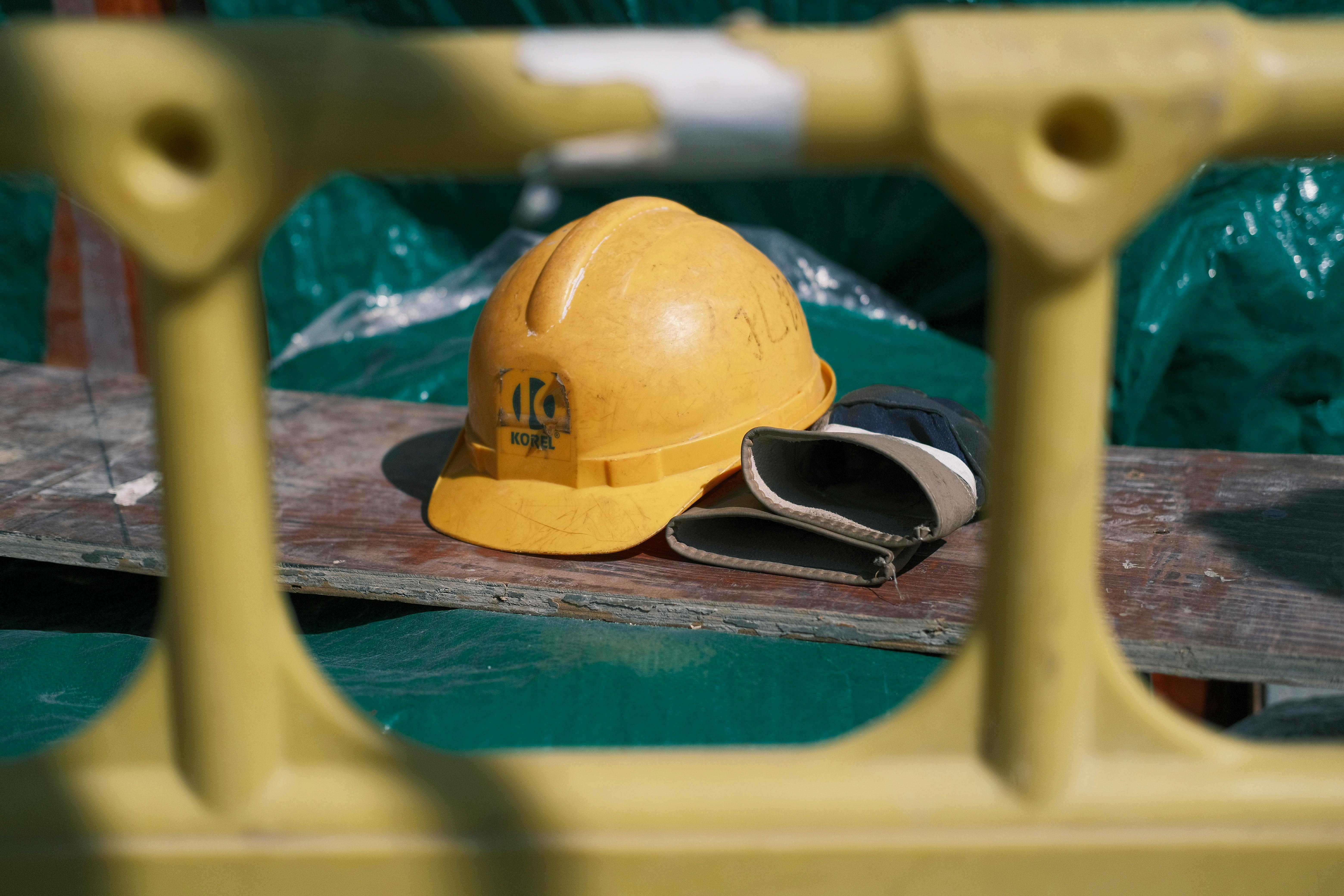 yellow-construction-helmet-on-industrial-site